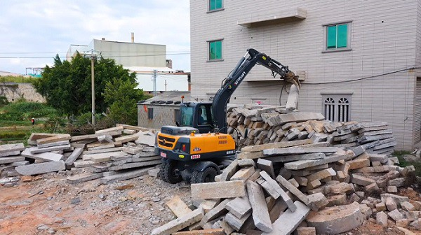 Explain how to clean the water tank of the excavator
